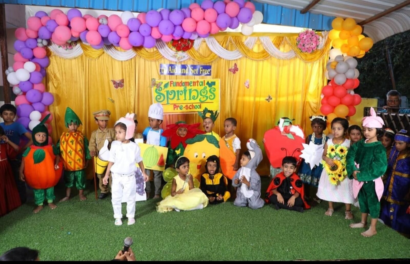 Children performing on stage at the Springs Pre School annual day